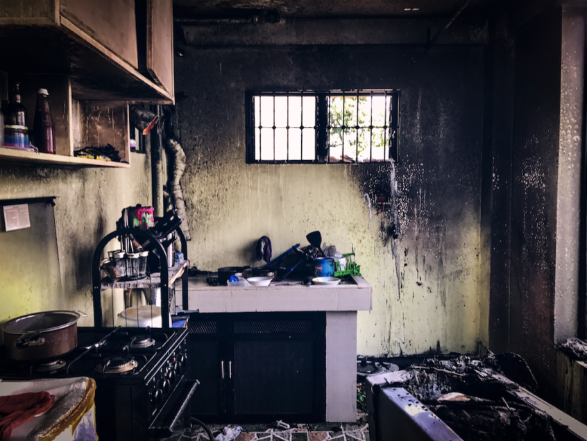Interior of a kitchen with fire damage