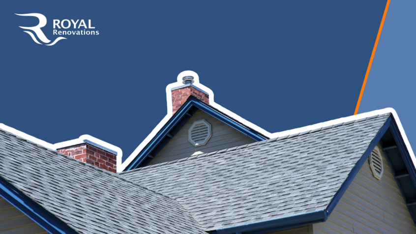 A residential roof on a sunny day. The roof features two chimneys and two attic vents.